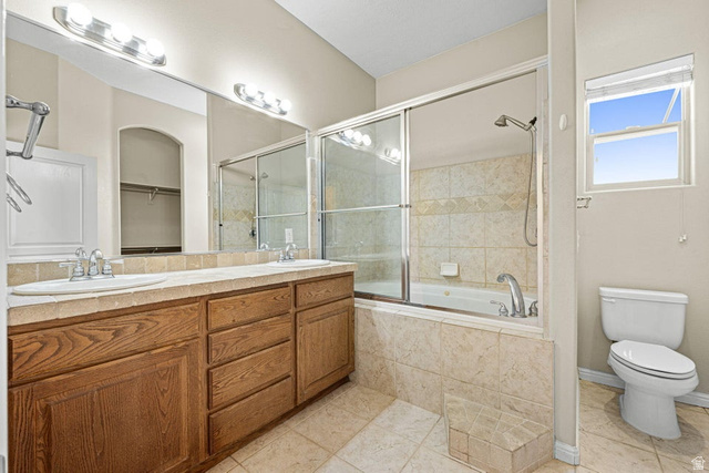 2226 East 140 South St. George, UT 84790 - Photo 16 of 20 Bathroom with a dual vanity featuring wood-finish cabinetry and a light-toned countertop