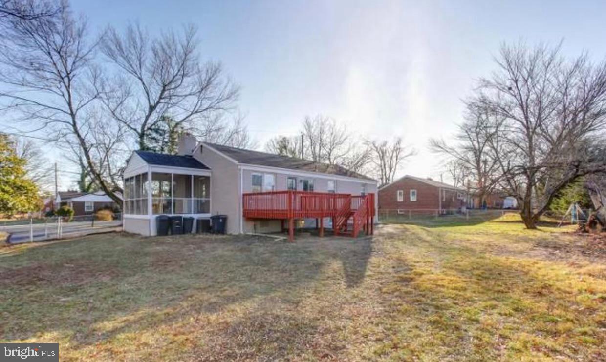 5806 Burgess Road District Heights, MD 20747 - Photo 2 of 11 a view of a yard with a large tree in front of a house