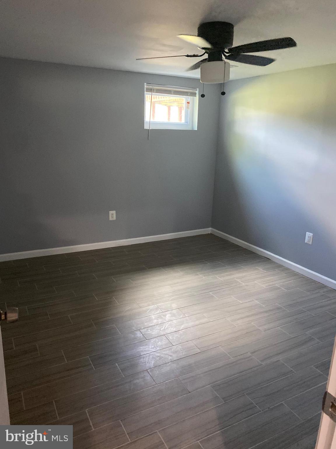 5806 Burgess Road District Heights, MD 20747 - Photo 6 of 11 a view of a room with wooden floor and windows