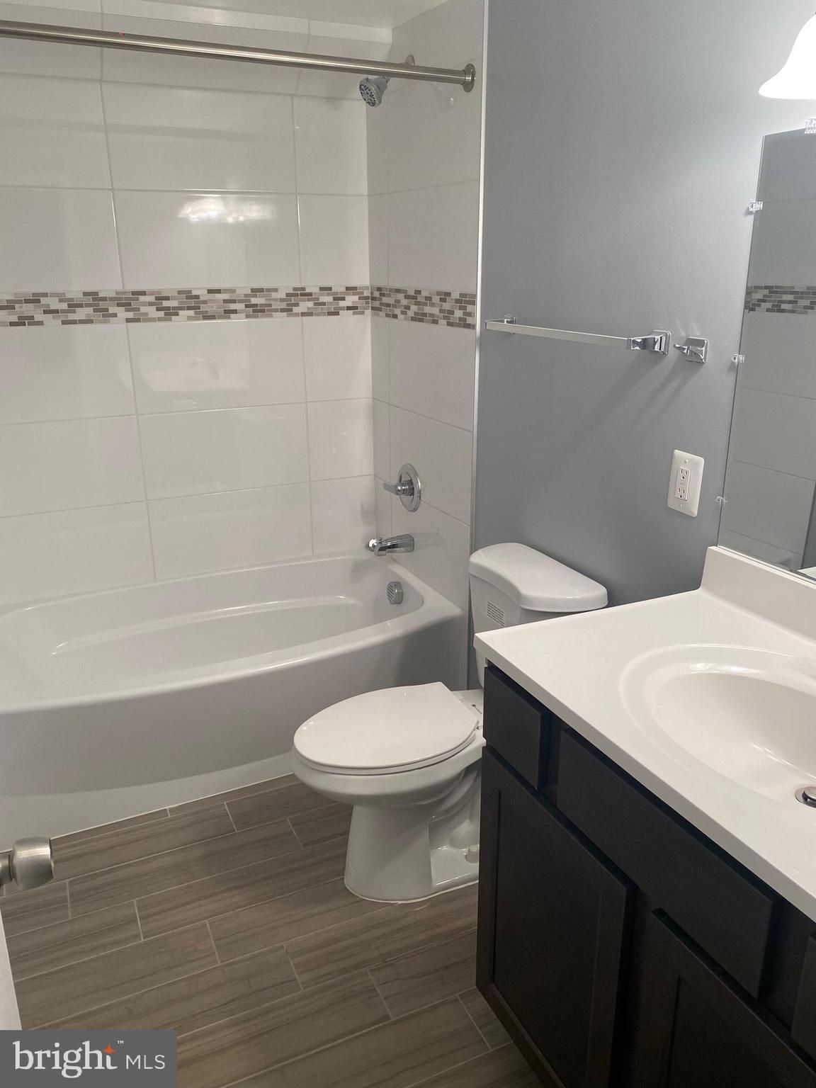 5806 Burgess Road District Heights, MD 20747 - Photo 10 of 11 a bathroom with a sink a toilet and shower