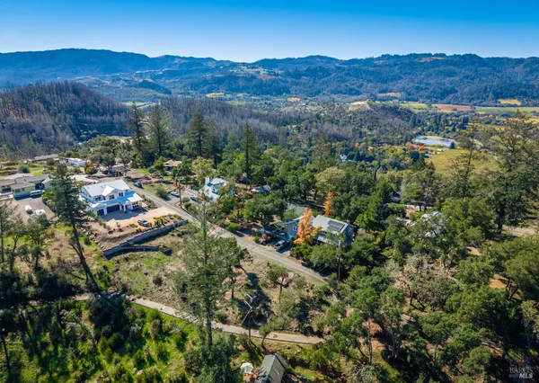 an aerial view of residential house and green space