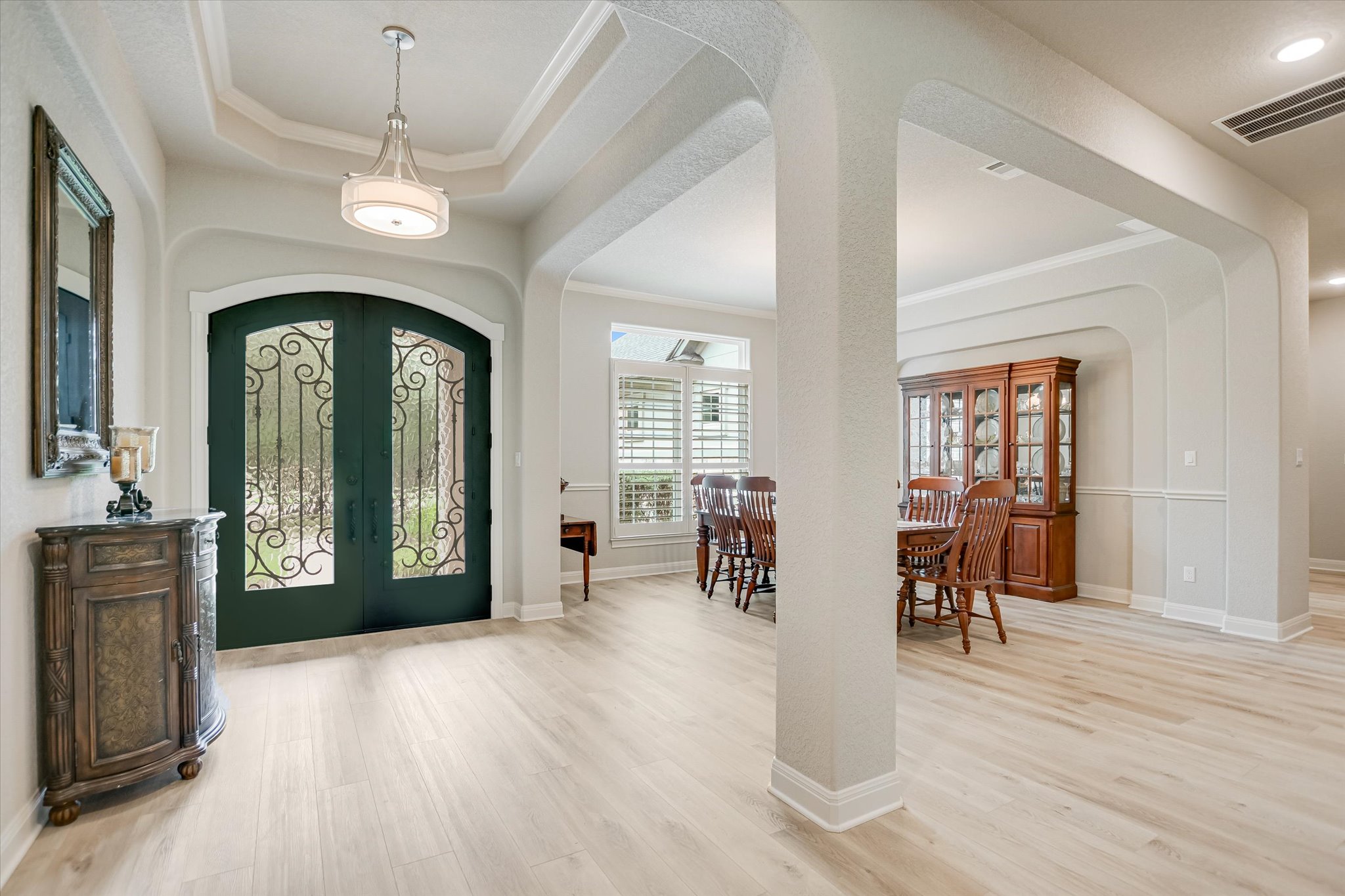 2561 Ridley House Cove Leander, TX 78641 - Photo 10 of 36 Grand entryway featuring arched double doors with decorative wrought iron accents