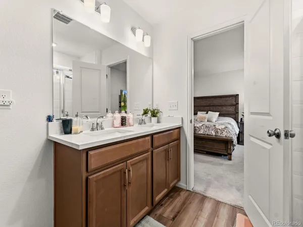 a bedroom with a bed and a desk