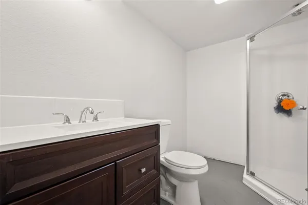 a bedroom with a bed and a mirror