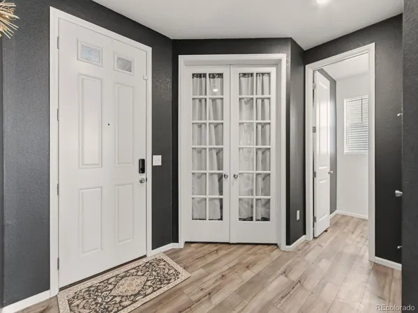 an empty room with windows and closet