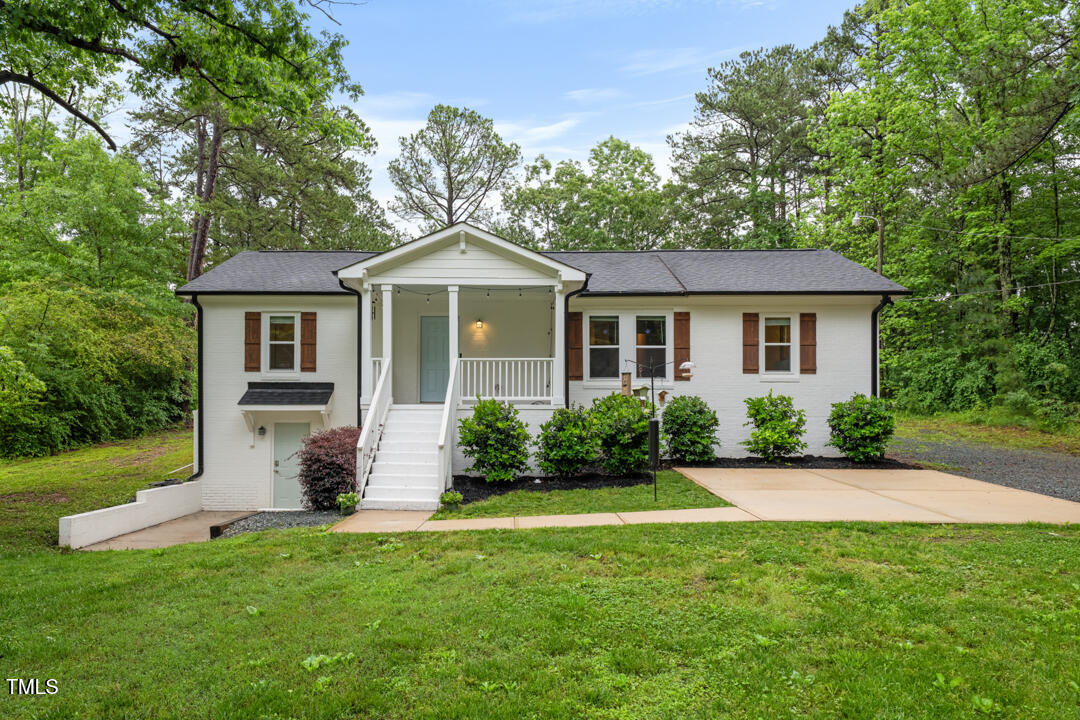 5020 Mimosa Drive Durham, NC 27713 - Photo 1 of 35 a front view of a house with a yard