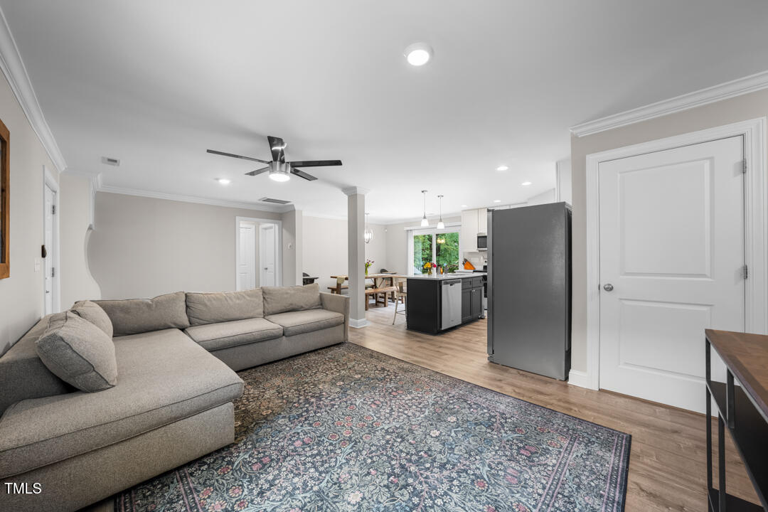 5020 Mimosa Drive Durham, NC 27713 - Photo 9 of 35 a living room with furniture wooden floor and a rug