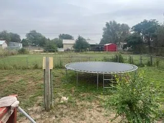 a bathroom with a granite countertop sink a mirror and tub