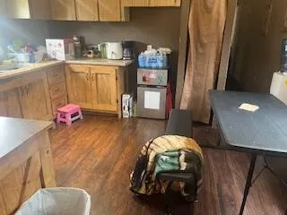 a white toilet sitting next to a bath tub