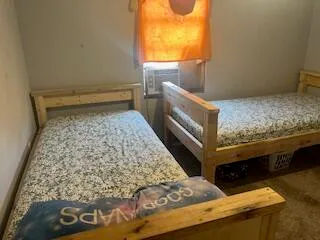 a bathroom with a toilet and shower curtain