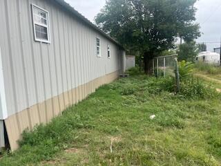 6806 North County Road 1630 Shallowater, TX 79363 - Photo 25 of 40 a backyard of a house with lots of green space