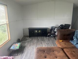 6806 North County Road 1630 Shallowater, TX 79363 - Photo 29 of 40 a living room with furniture and a wooden floor