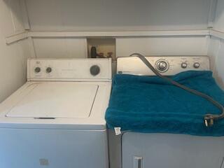 6806 North County Road 1630 Shallowater, TX 79363 - Photo 37 of 40 a utility room with washer and dryer