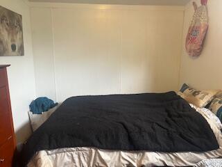 6806 North County Road 1630 Shallowater, TX 79363 - Photo 8 of 40 a bedroom with a bed and cabinet