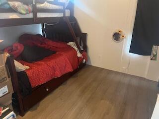 6806 North County Road 1630 Shallowater, TX 79363 - Photo 9 of 40 a bed sitting in a bedroom next to a window