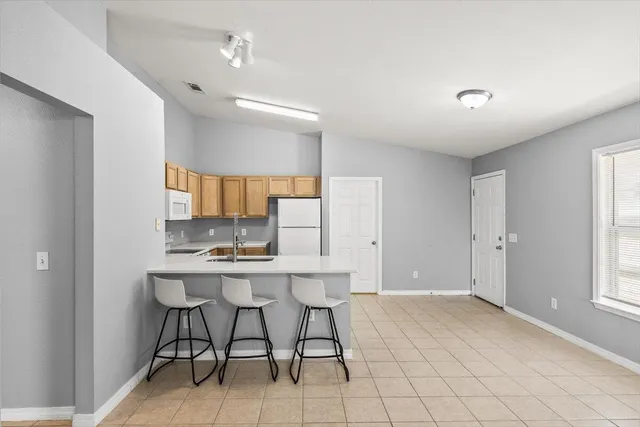 a view of kitchen with furniture and window