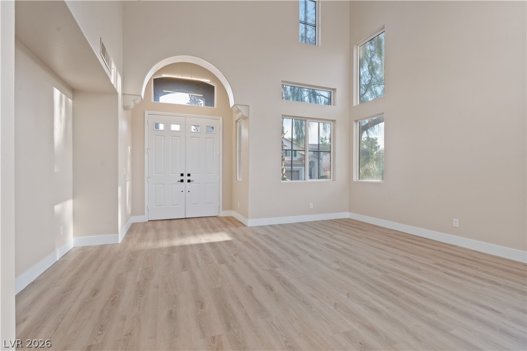 1662 Ravanusa Drive Henderson, NV 89052 - Photo 70 of 74 A grand entrance with double doors and abundant natural light creates an inviting welcome.