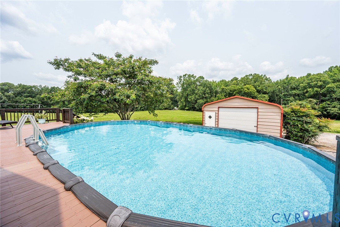 827 Sutherland Road Church Road, VA 23833 - Photo 35 of 51 Above-ground pool featuring a surrounding wood dec