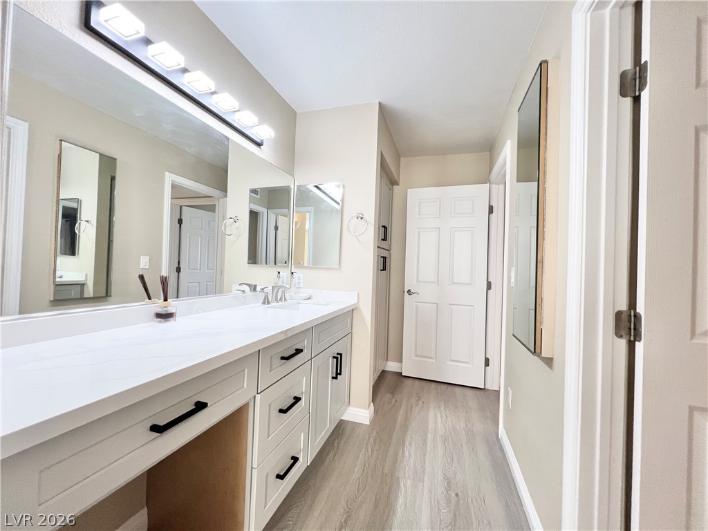 8070 West Russell Road, Unit 2070 Las Vegas, NV 89113 - Photo 10 of 27 Bathroom and way to 2nd bedroom