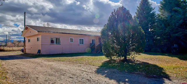 a view of a house with a back yard