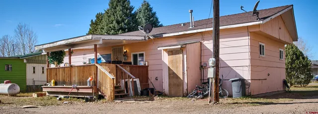 a view of a small house with a tub