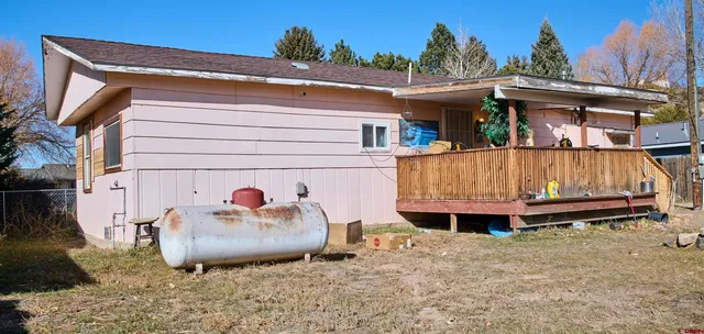 a backyard of a house with wooden floor