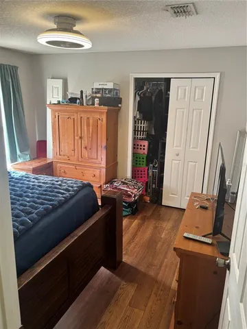 a bedroom with furniture and a window