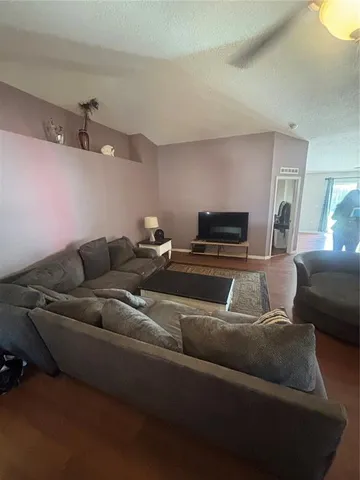 a living room with a couch and a stove