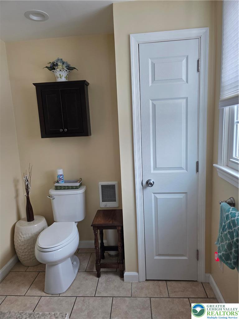 189 West Berger Street Emmaus, PA 18049 - Photo 11 of 26 a white toilet sitting next to a bathroom sink