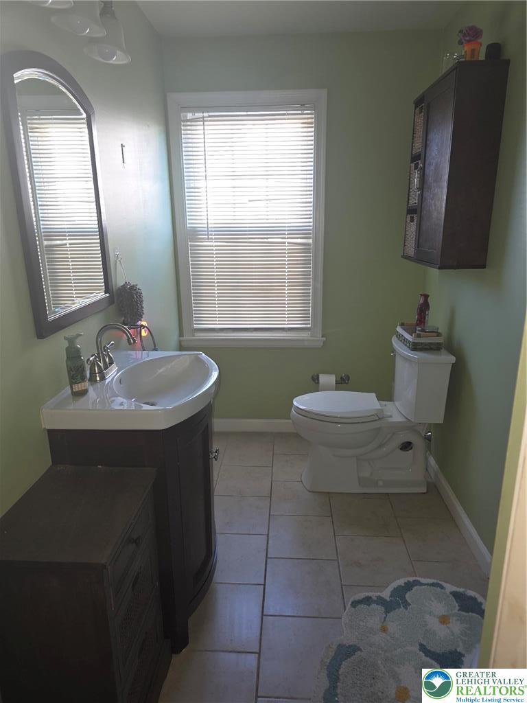 189 West Berger Street Emmaus, PA 18049 - Photo 14 of 26 a bathroom with a sink toilet and mirror