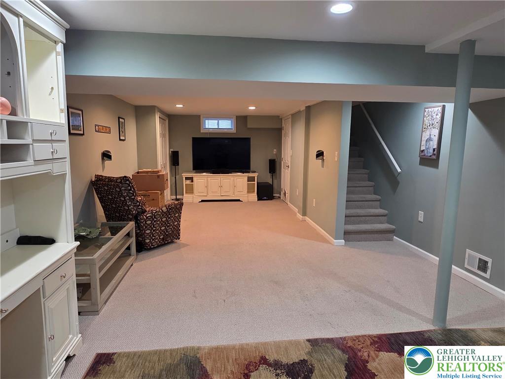 189 West Berger Street Emmaus, PA 18049 - Photo 18 of 26 a living room with furniture and a flat screen tv