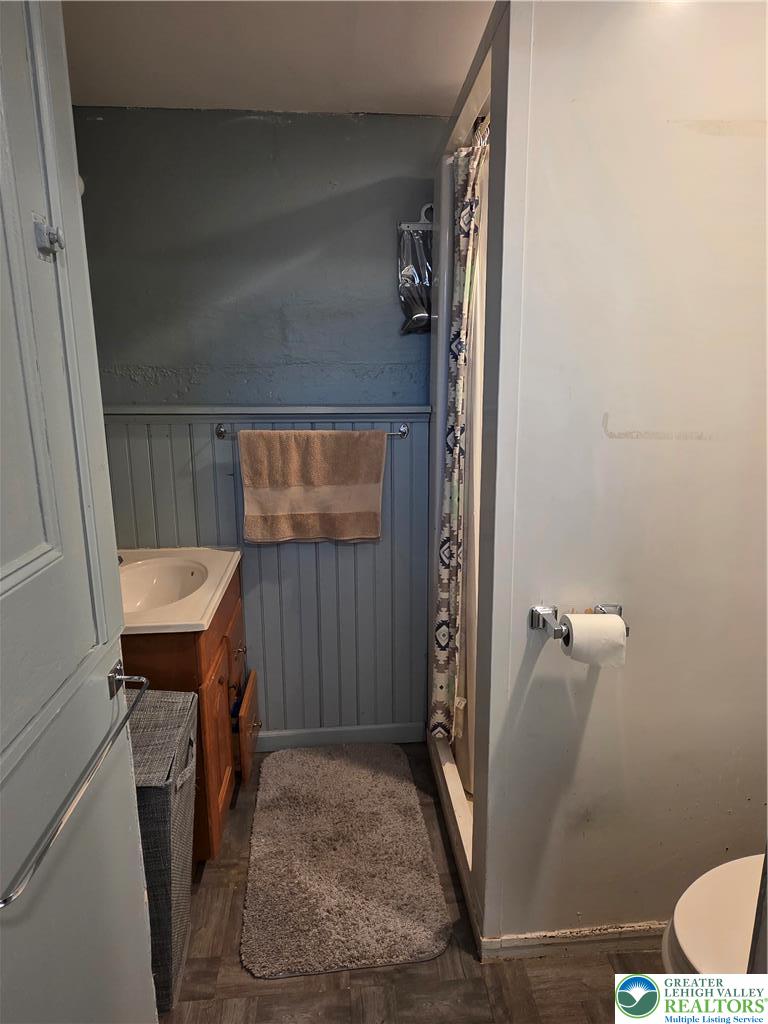 189 West Berger Street Emmaus, PA 18049 - Photo 20 of 26 a bathroom with a sink a toilet a mirror and shower