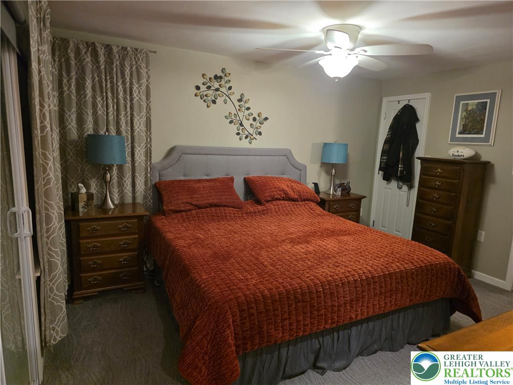 189 West Berger Street Emmaus, PA 18049 - Photo 7 of 26 a bedroom with a bed and a chandelier