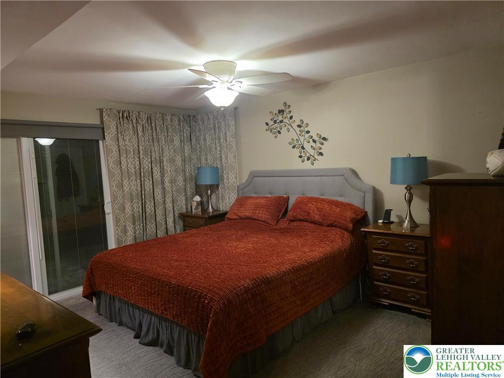 189 West Berger Street Emmaus, PA 18049 - Photo 8 of 26 a bedroom with a bed and a chandelier