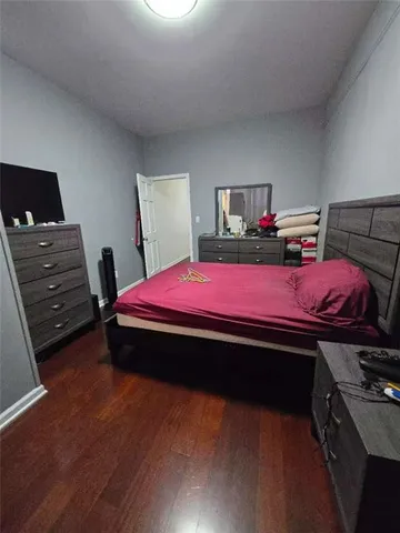 a bedroom with a bed and a table
