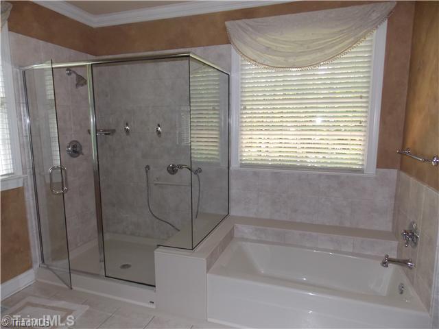 8501 Rosedale Drive Oak Ridge, NC 27310 - Photo 11 of 16 Master Bath/Spa. Huge shower with soaker tub with tile surround