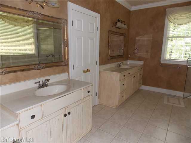 8501 Rosedale Drive Oak Ridge, NC 27310 - Photo 12 of 16 Master Bath/Spa. Separate his and her vanities