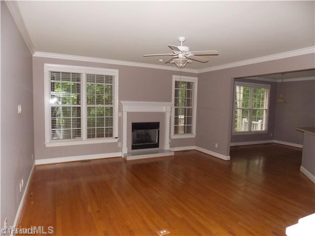 8501 Rosedale Drive Oak Ridge, NC 27310 - Photo 8 of 16 Den/Family/Great Room. Den with lots of area to enjoy your family. Features hardwood floors and fireplace with gas logs.