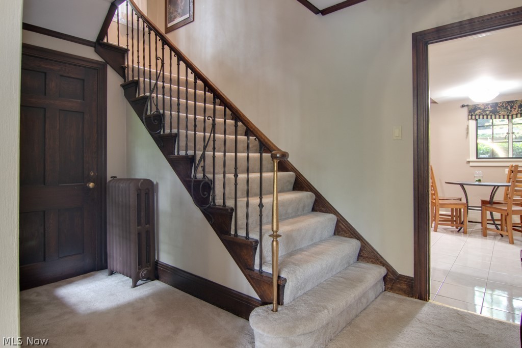 376 Merriman Road Akron, OH 44303 - Photo 11 of 30 Stairway to second floor with original iron spindles.