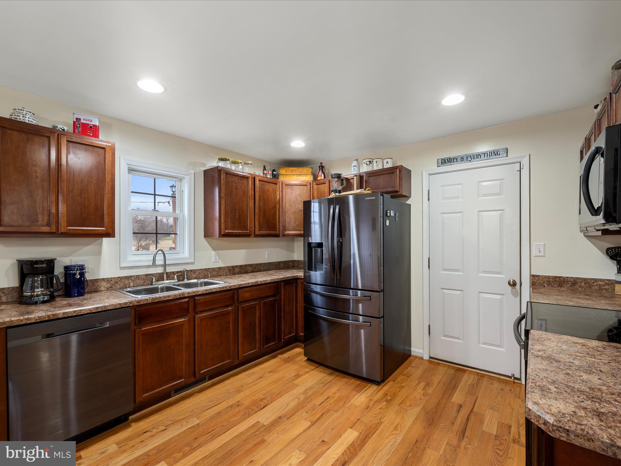 480 Hites Road Stephens City, VA 22655 - Photo 11 of 42 a kitchen with stainless steel appliances granite countertop a refrigerator and a sink