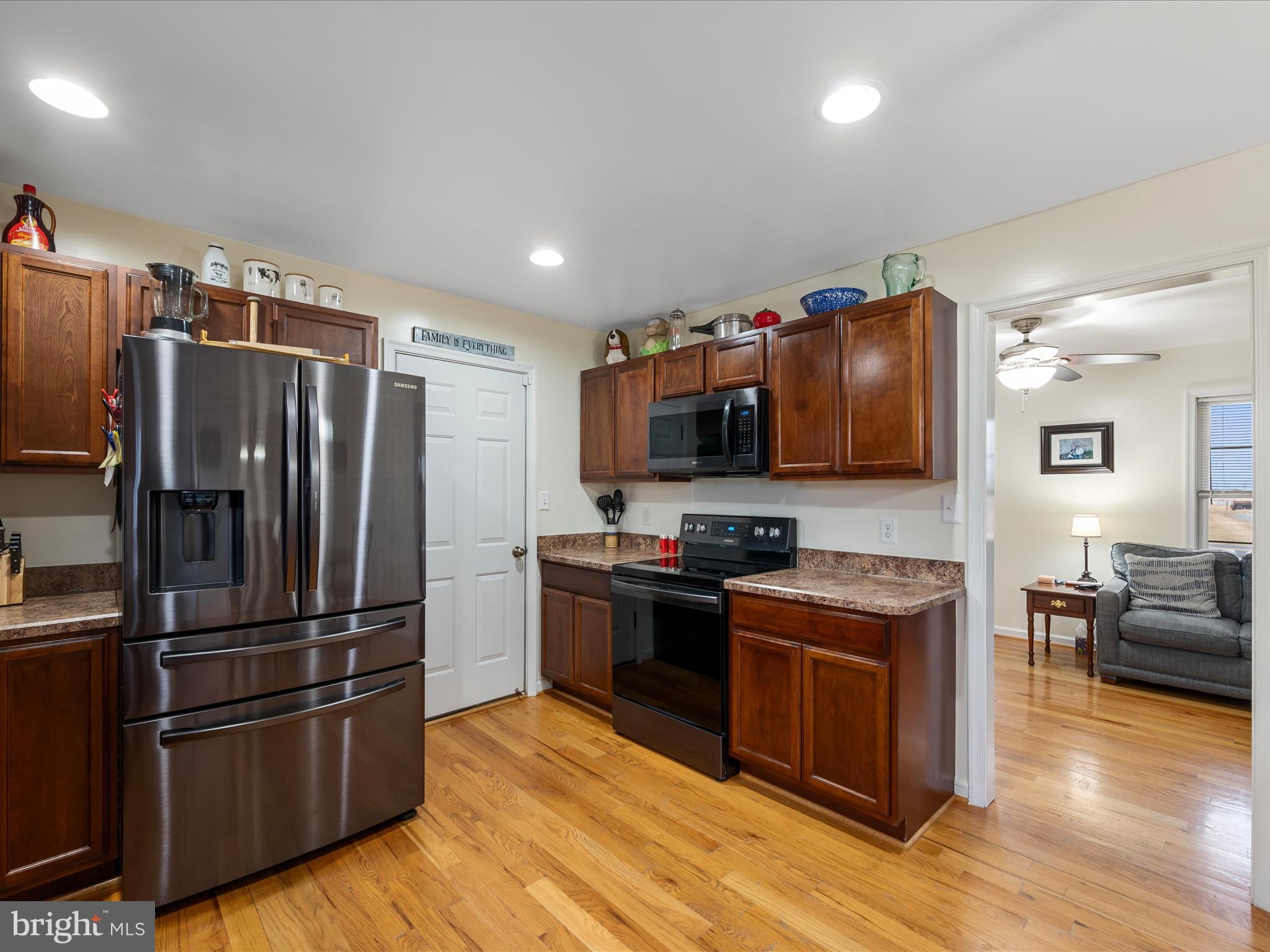 480 Hites Road Stephens City, VA 22655 - Photo 12 of 42 a kitchen with stainless steel appliances granite countertop a refrigerator stove and wooden floor