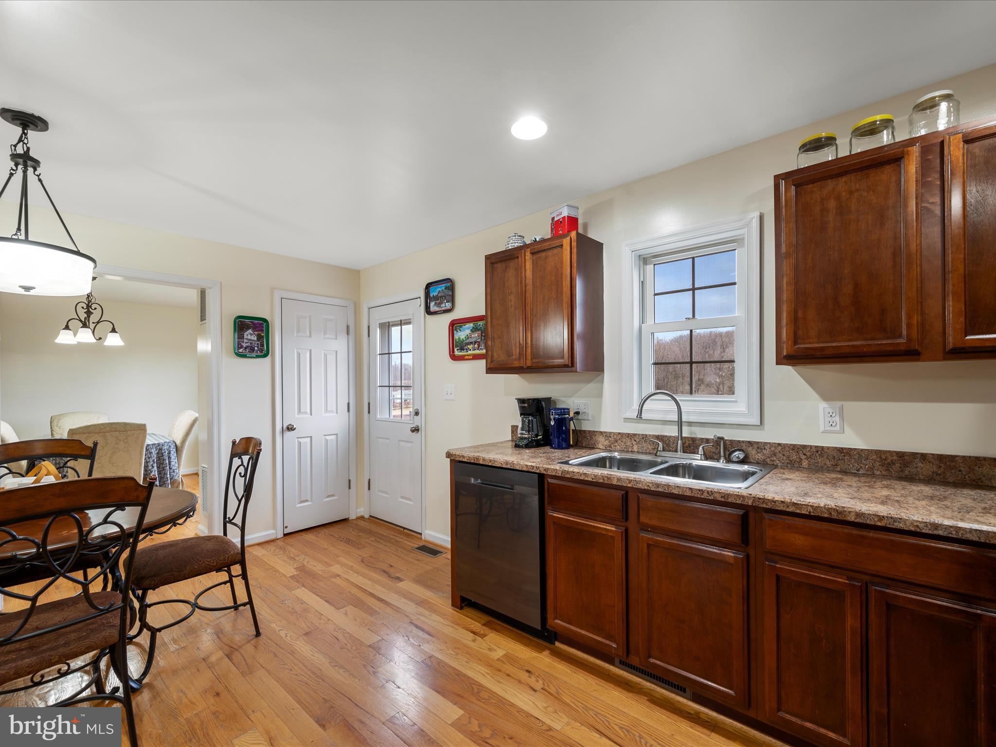 480 Hites Road Stephens City, VA 22655 - Photo 14 of 42 a kitchen with a sink cabinets and wooden floor