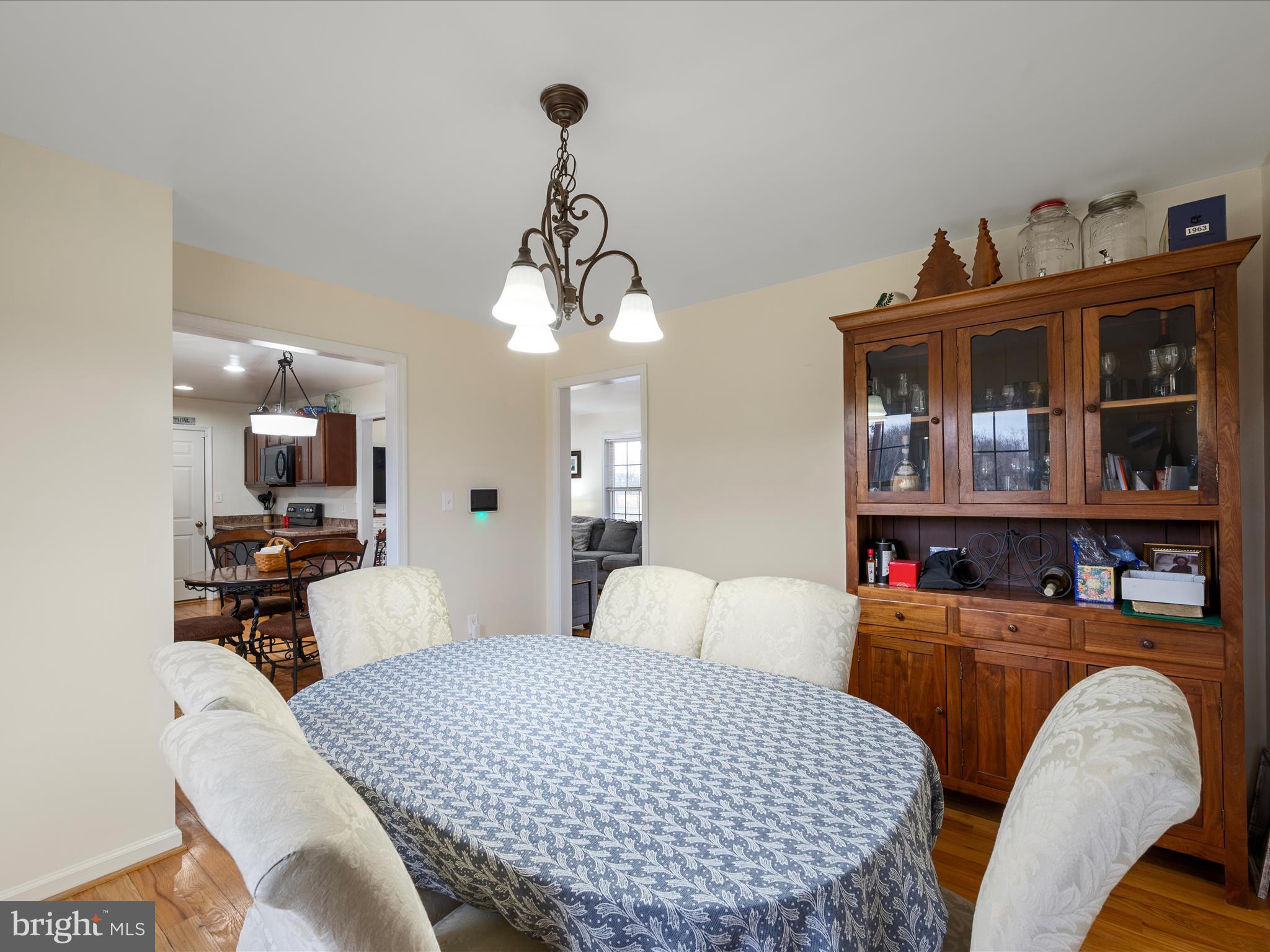 480 Hites Road Stephens City, VA 22655 - Photo 17 of 42 a bedroom with furniture and a chandelier