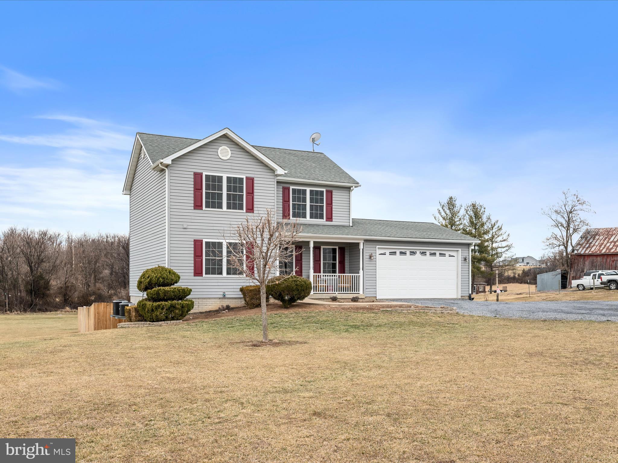 480 Hites Road Stephens City, VA 22655 - Photo 3 of 42 a front view of a house with a garden