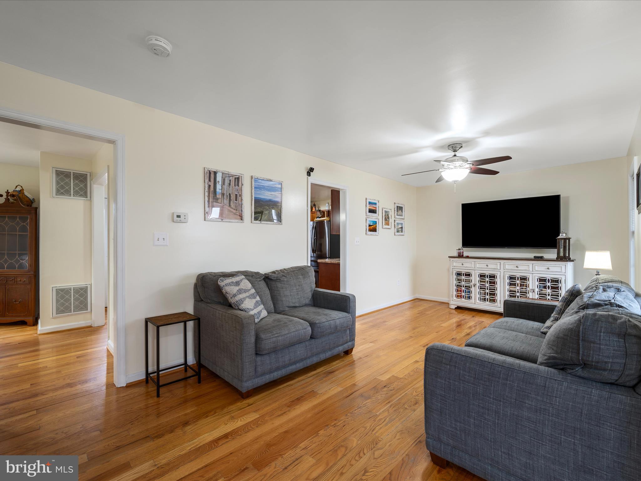 480 Hites Road Stephens City, VA 22655 - Photo 9 of 42 a living room with furniture and a flat screen tv