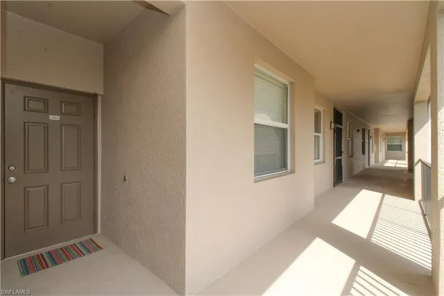 a bedroom with a bed and a lamp