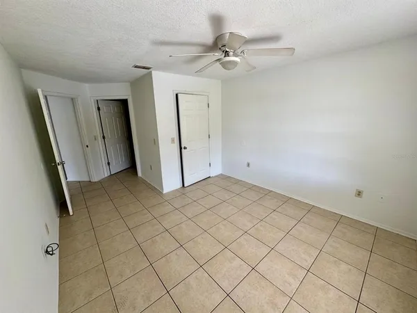 a view of an empty room and a window
