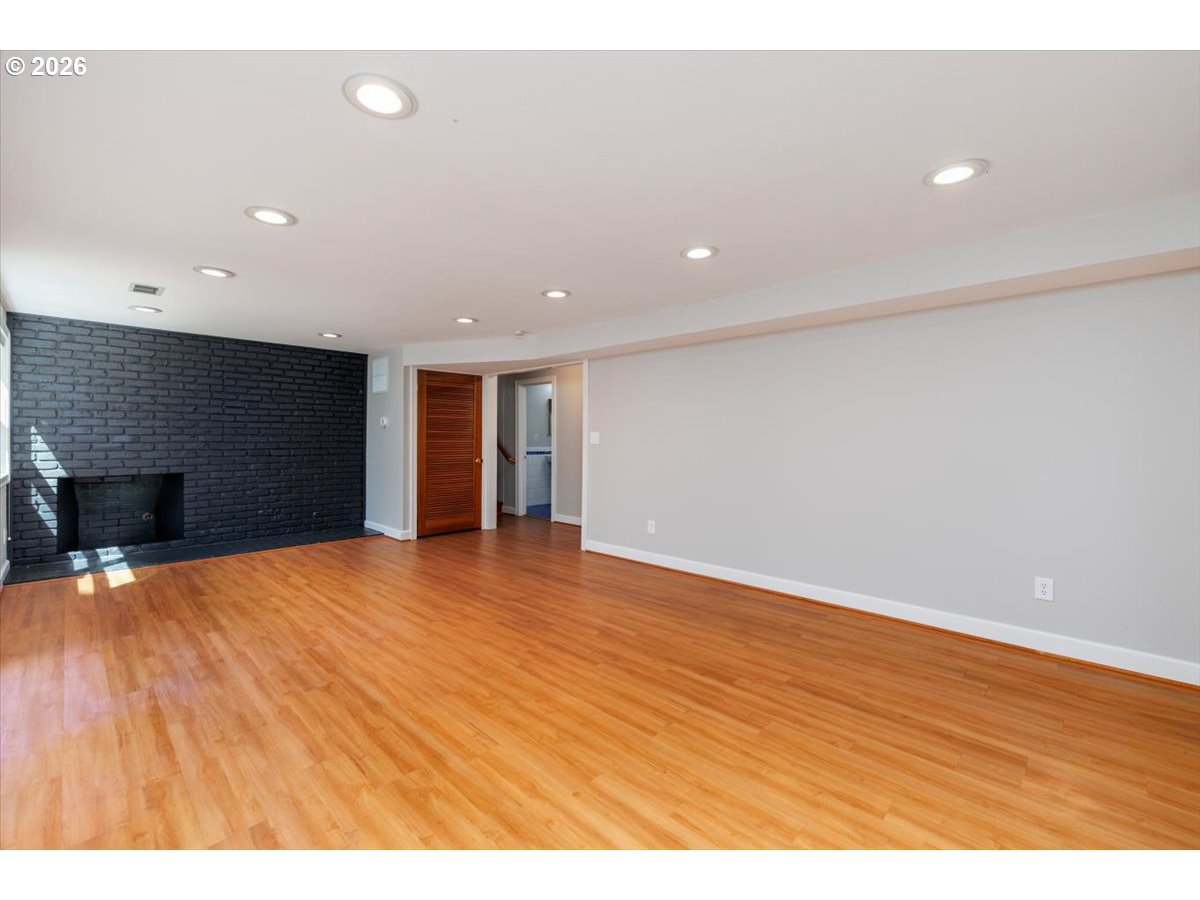 175 Northwest 95th Avenue Portland, OR 97229 - Photo 25 of 46 a view of an empty room with wooden floor and closet