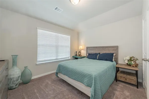 a room with a bench and a window