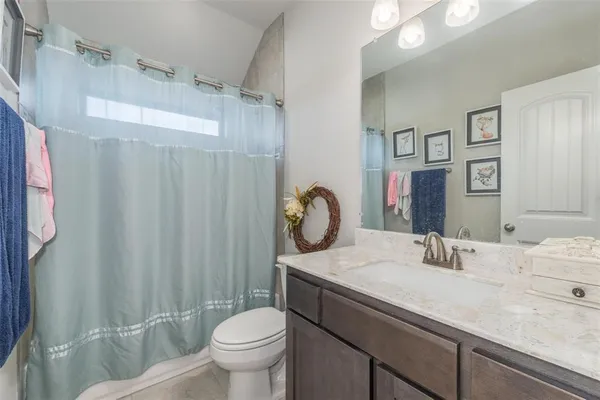 a view of a hallway with wooden floor and entryway